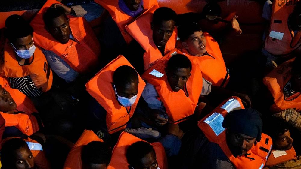 Hundreds of migrants rescued from smugglers' boats in Mediterranean
