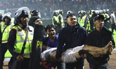 At least 174 dead after fans stampede to exit Indonesian football match