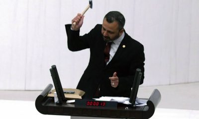 Turkish MP smashes phone with hammer in furious speech over social media law