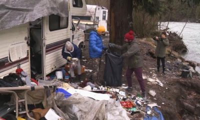 Volunteers clean up abandoned encampment in B.C.’s Fraser Valley - BC
