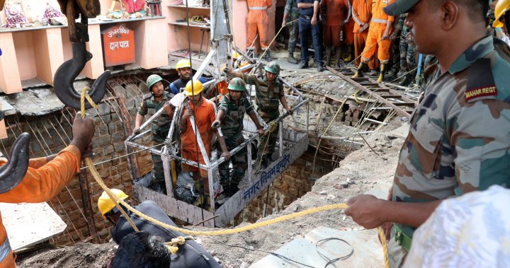 Indian officials discover 36 bodies inside well after temple collapse - National