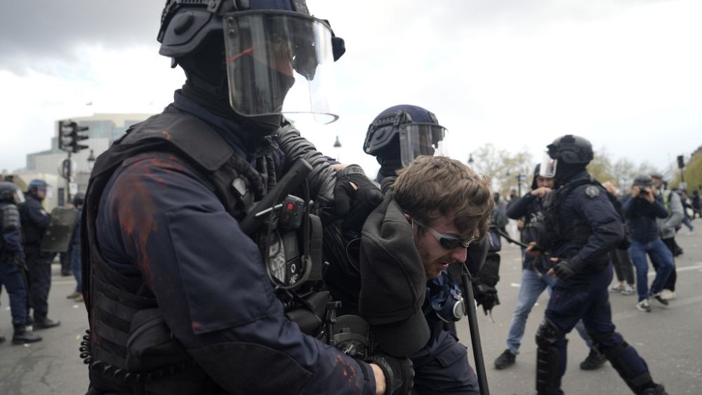 Protesters clash with police ahead of crucial vote on Macron's controversial pension reform plan