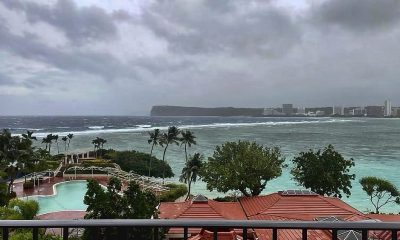 Rain and winds lash Guam as Typhoon Mawar closes in and residents shelter