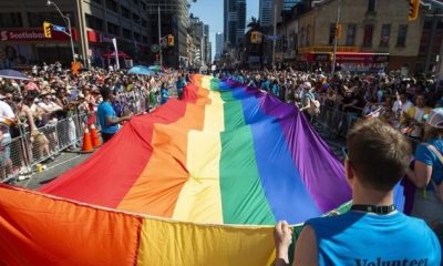 Large crowds pack Toronto streets as Canada’s largest Pride parade begins - Toronto