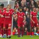 Salah scores twice as Liverpool beats 10-man Everton 2-0 in Merseyside derby in Premier League