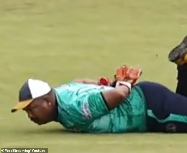 He had to lay very still with the ball still on his back so a fielder could pluck it off and claim the dismissal