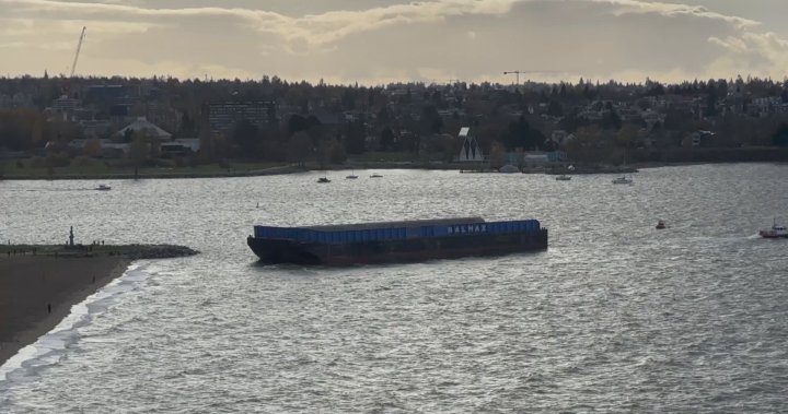 Runaway barge wrangled from hitting Vancouver’s English Bay Beach - BC