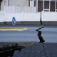 Fissures open up on the streets of an Iceland fishing town near a volcano that may soon erupt