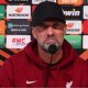 Jurgen Klopp fumes as Toulouse fans interrupt his press conference held in a TENT with raucous chanting after 3-2 Europa League win over Liverpool... and asks 'Who had the idea to do the press conference here?'