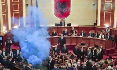Flares, fires and barricades: Why Albania's opposition party likes to protest in parliament