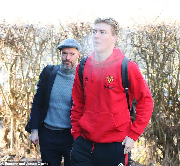 Manchester United manager Erik ten Hag and striker Rasmus Hojlund prepare to board the team bus after their flight to Newcastle was cancelled on Saturday morning