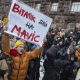Protesters in Kyiv demand funds redirected from civil works to war effort