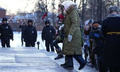 Wives of Russian soldiers lay flowers in Moscow to protest against the Kremlin