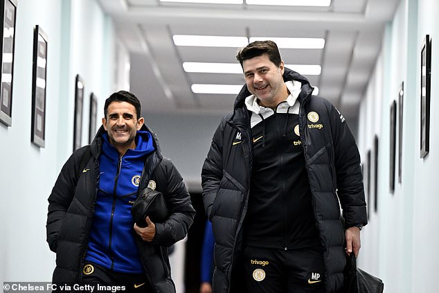 After fans gave him a hostile reception outside the stadium, Pochettino (right) was all smiles inside Villa Park as he prepared to take on Aston Villa in Chelsea's FA Cup fourth round replay