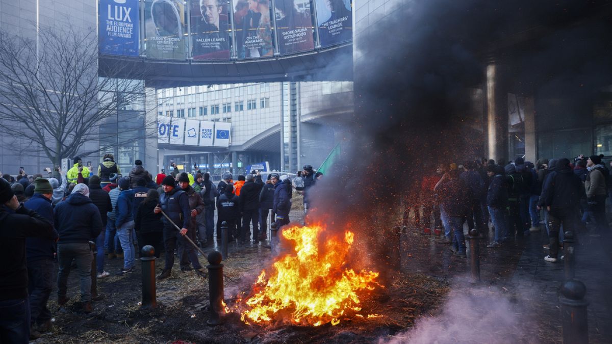 Angry farmers invade the streets of Brussels as EU leaders meet over Ukraine