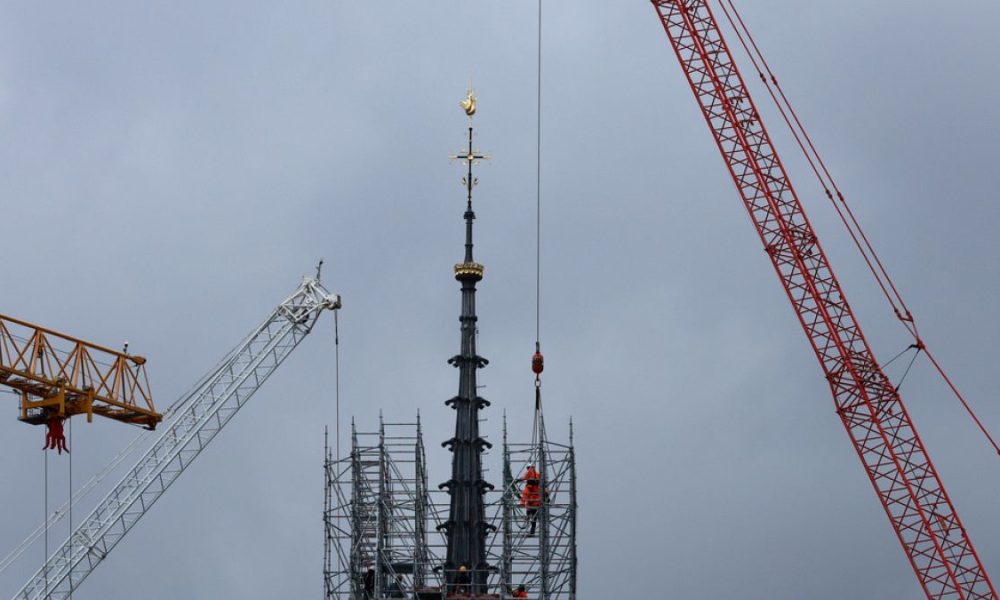 Notre Dame reveals new spire and golden rooster as scaffolding removed