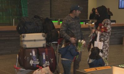 Calgary airport hosts tearful reunion for Afghan refugees: ‘My family is free’