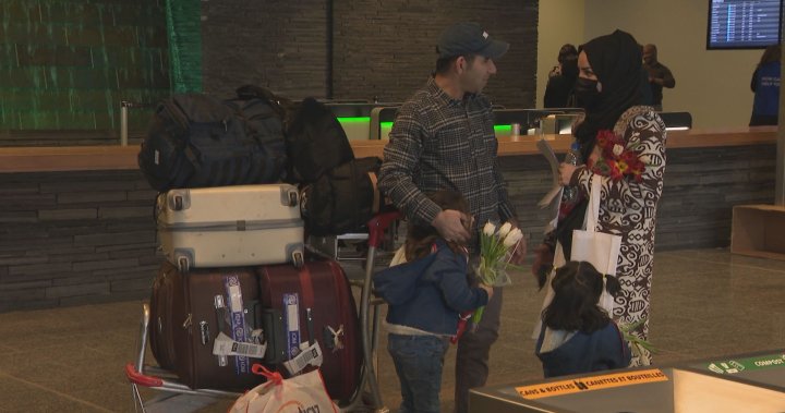 Calgary airport hosts tearful reunion for Afghan refugees: ‘My family is free’