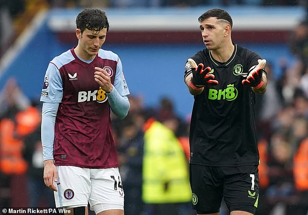 Emi Martinez (right) endured a strange afternoon, having to pick the ball out of his net twice in three minutes and then twice again in injury time