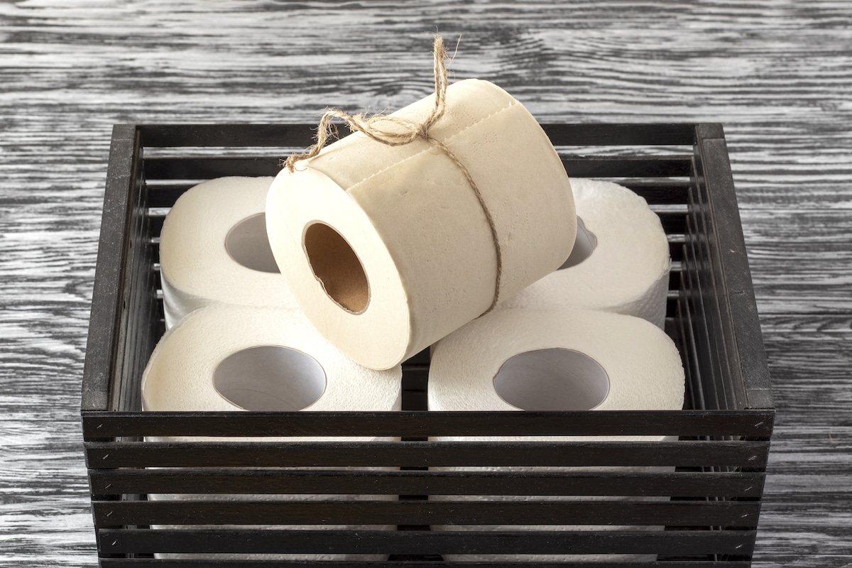 Rolls of bamboo toilet paper in a black wooden box