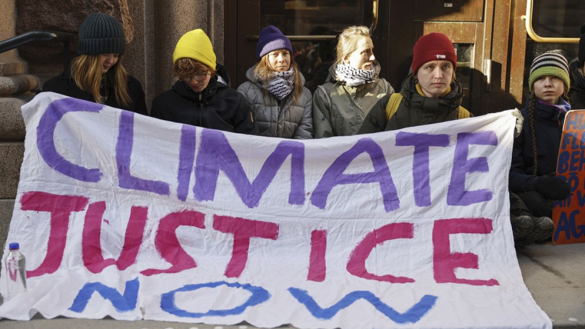 Climate activists alongside Greta Thunberg block the Swedish parliament