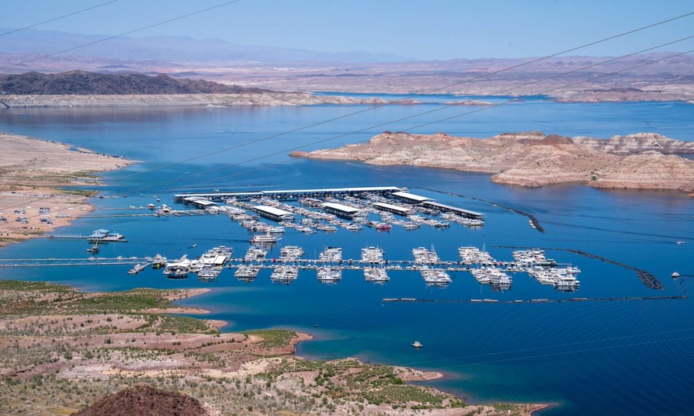 Boats docked along the shores of the Colorado River forming Lake Mead in Boulder City, Nevada
