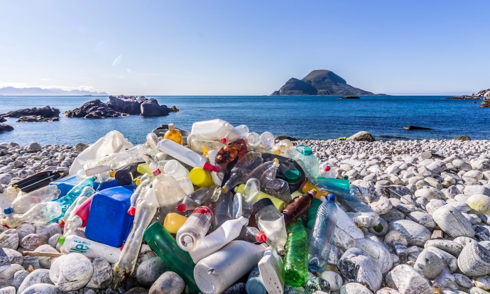 Plastic bottles littering a beach in Norway