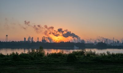 Smoke billows from chemical plants over an industrial and residential area of Baton Rouge, Louisiana known as “Cancer Alley”
