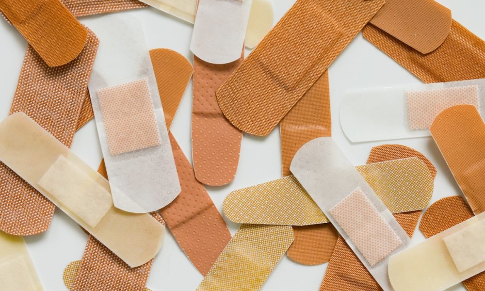 A group of bandages in various colors and sizes
