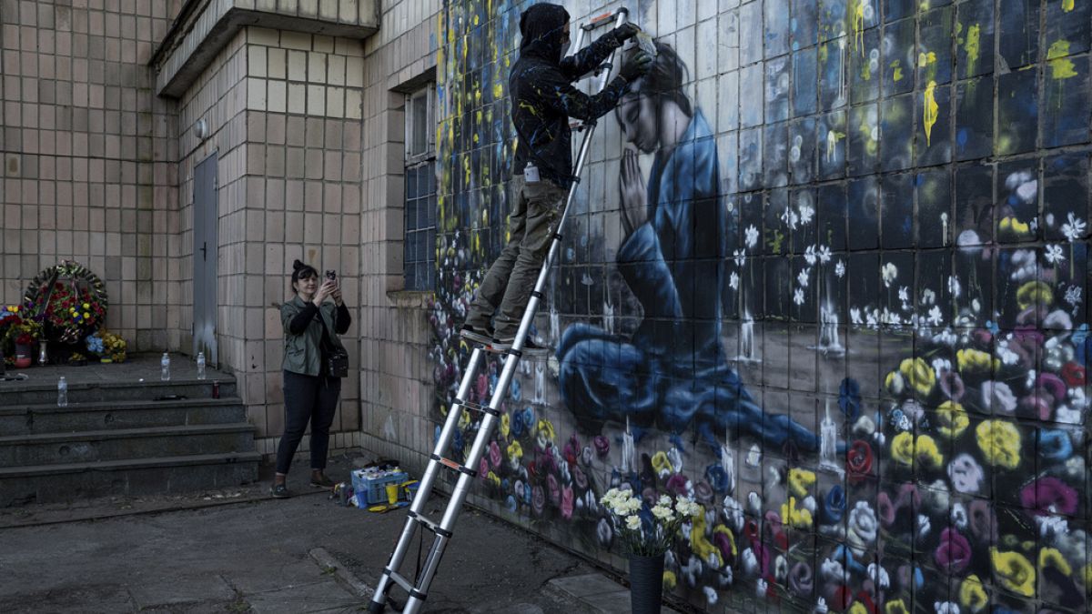 US artists paint memorial for civilians killed by Russian forces in Ukraine's Bucha