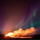 Video. WATCH: Northern Lights shine over an erupting volcano in Iceland
