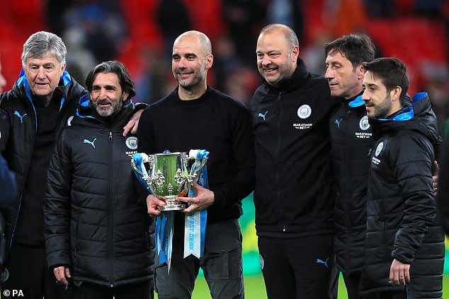Jover (right) with Pep Guardiola and City's coaching staff after they won the 2020 League Cup