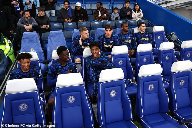 Chelsea's youngsters look delighted as they take their place on the bench prior to kick-off