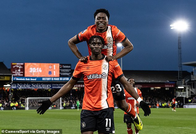 Luton's equaliser came courtesy of Elijah Adebayo (bottom), who admitted that the dressing room was 'flat'