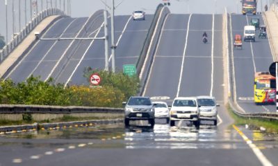 Vehicles on an expressway with a heat mirage visible during a countrywide heat wave in Dhaka, Bangladesh