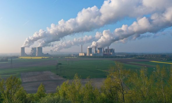 Steam rises from cooling towers at the Neurath and Niederaussem coal-fired power plants at Neurath, Germany